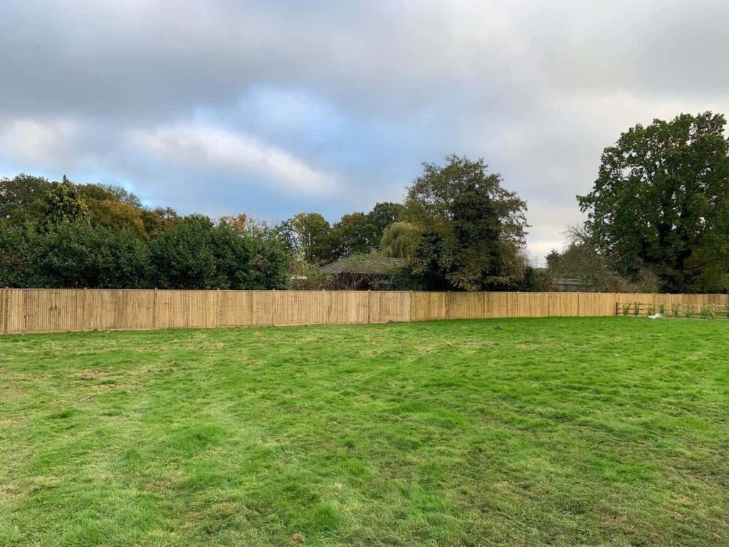 This is a photo of feather edge fencing installed around the edge of a field by Fast Fix Fencing Crowborough