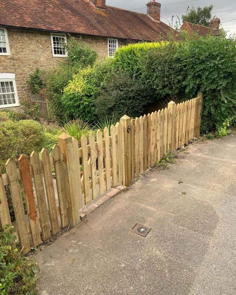 This is a photo of a picket fence and picket gate installed by Fast Fix Fencing Crowborough